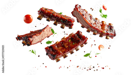 BBQ pork ribs levitating with herbs and pepper on black