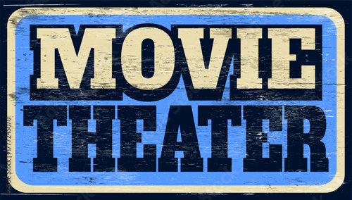 Aged retro movie theater sign on wood