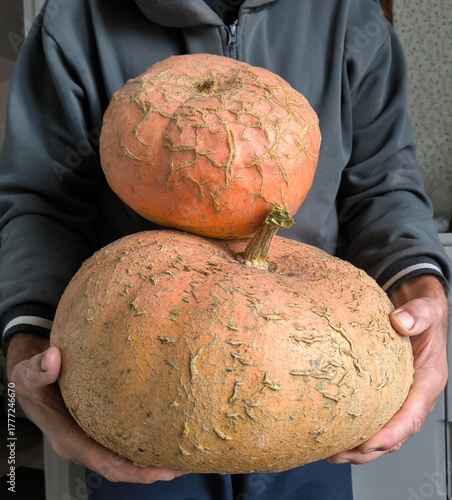 man holding pumpkin