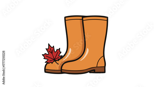 A pair of orange rain boots with a red autumn maple leaf resting on the toe, isolated on a white background.