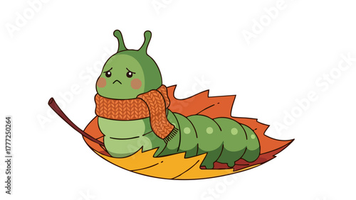 A cute green cartoon caterpillar wearing an orange scarf, looking sad while resting on colorful autumn leaves.
