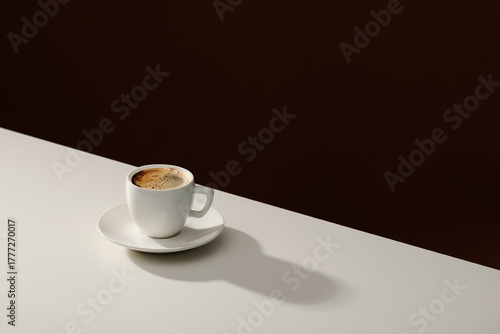 A cup of coffee and coffee beans on the table.  Copy space of your text.