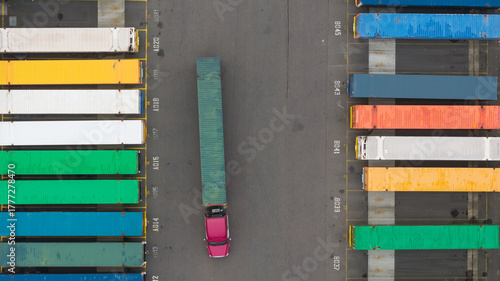 Aerial top down view of Colorful containers and Semi truck at Container yard in Portland, Oregon.