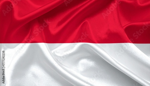 Wrinkled Indonesian flag with red top and white bottom bands, symbolizing courage and purity.