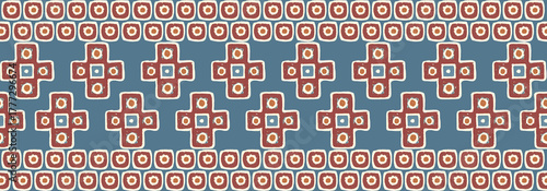 Seamless ethnic border strip with geometric crosses and dot tiles in terracotta and blue for apparel trim
