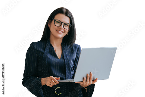 Confident American young businesswoman in suit standing on transparent background with laptop looks at camera