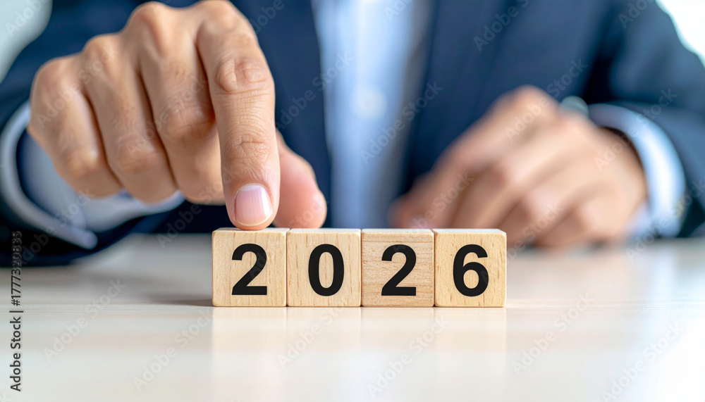 custom made wallpaper toronto digitalPerson in suit is changing wooden calendar cubes from 2025 to 2026, symbolizing transition and future planning