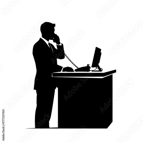 Businessman Silhouette Talking on Phone at Desk With Computer and Phone in Office Setting