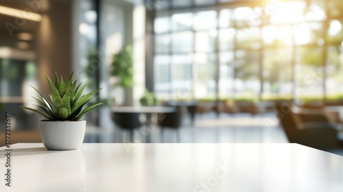 Empty white table in modern cafe, sunlight through windows.  Possible use Commercial or residential interior design