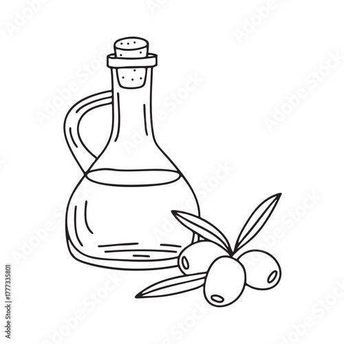 Glass bottle of olive oil placed beside green olives