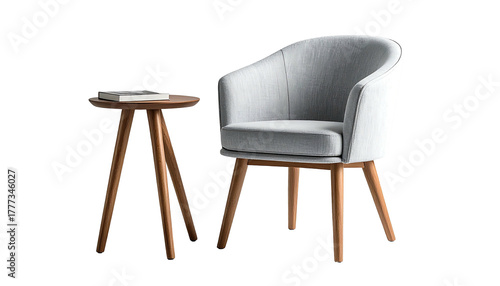 Grey armchair and small wood side table against a black background