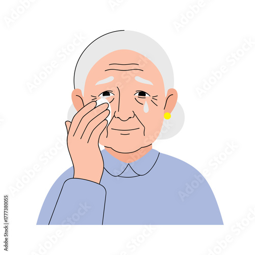 Elderly person wiping tears while expressing sadness at home  