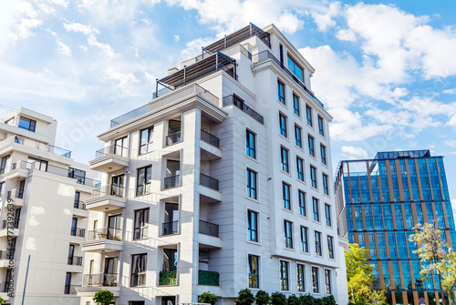 Modern  Residential Apartment Building Complex Condo  on a blue sky background 