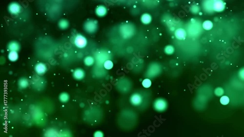 Bokeh natural glittering green particles. Abstract background with shining bokeh sparkles. Smooth animation. for your logotext. Abstract green bokeh particles seamless loop 4k 