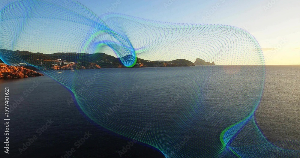 Obraz premium Flowing digital mesh wave overlay sweeping across seaside at sunset with rocky coastline and hills
