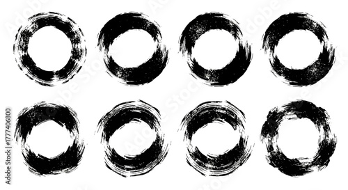 Eight rough black rings arranged in two rows appear on a white background
