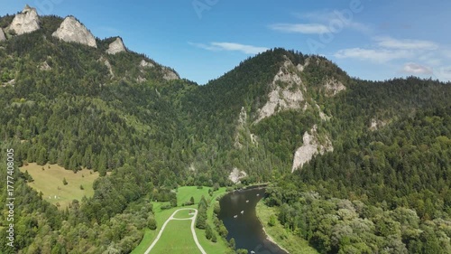 Scenic Aerial View of Czorsztyn Lake and Cycling Route in Southern Poland with Mountains, Forests and Green Valleys