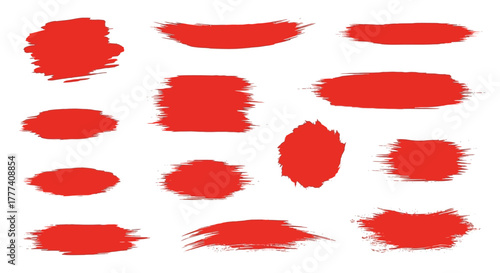 Red paint strokes varied shapes and textures scattered on a white background