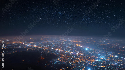 A mesmerizing view of a cityscape illuminated by countless lights under a starry night sky