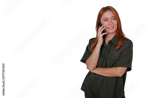 Young redhead woman communicating on phone, smiling and looking away with copy space, transparent background