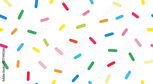 Scattered multicolored sprinkles, bright, simple, confectionery, on white backdrop