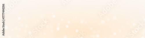 Glowing sparkle glitter dust magic softly floating across bright golden background.
