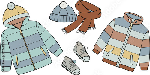 A product shot featuring a collection of children's winter clothing items arranged on a solid blue backdrop. The main subjects are various brightly colored winter jackets, knitted hats, scarves, and p