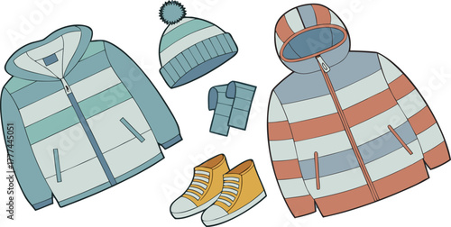 A product shot featuring a collection of children's winter clothing items arranged on a solid blue backdrop. The main subjects are various brightly colored winter jackets, knitted hats, scarves, and p