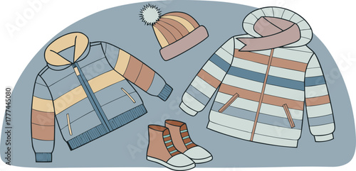 A product shot featuring a collection of children's winter clothing items arranged on a solid blue backdrop. The main subjects are various brightly colored winter jackets, knitted hats, scarves, and p