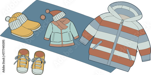 A product shot featuring a collection of children's winter clothing items arranged on a solid blue backdrop. The main subjects are various brightly colored winter jackets, knitted hats, scarves, and p