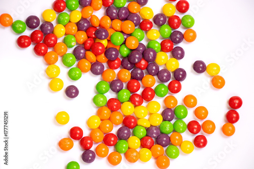 Schilderij op canvas Mix of colorful chewing candy similar to Skittles separated on the white background