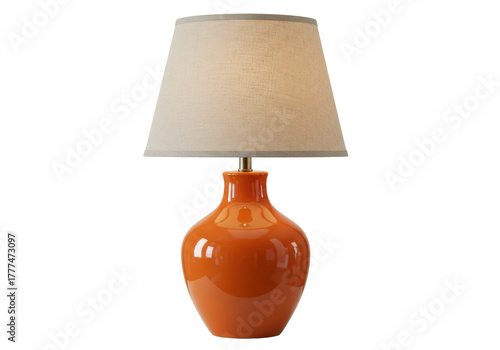 Isolated orange table lamp with cream shade for bedroom or living room décor, studio shot