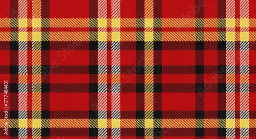 Seamless plaid tartan design pattern features intersecting stripes of color in a traditional Scottish style, creating an evenly repeating textile design. Design and Texture concept