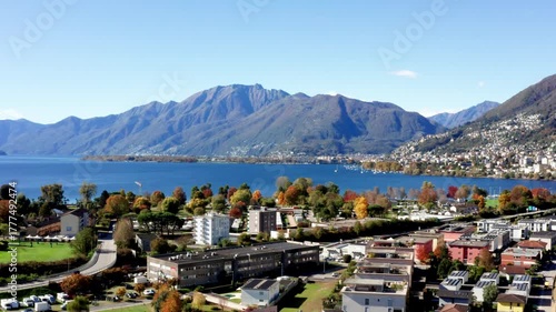 Aerial footage taken with a drone over Lake Maggiore in the canton of Ticino, Switzerland. A sunny autumn day with very clear skies.