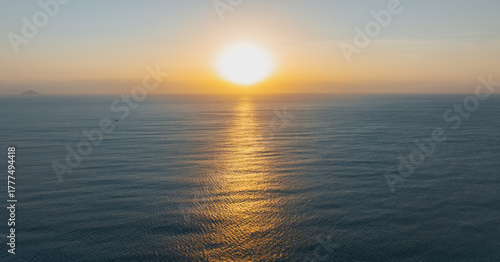 Aerial view of sunrise over sea landscape