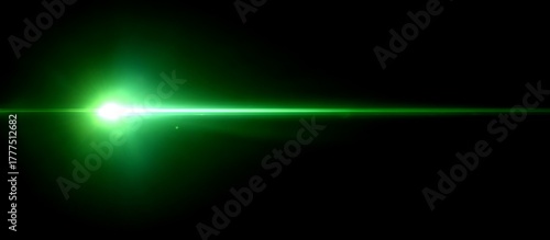 A bright green light flare emanates from the left, creating a lens flare effect on a dark background