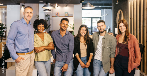 Bild auf Leinwand Group picture of diverse business team smiling at camera in modern office