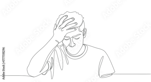 A person clutches their head, illustrating a feeling of distress or worry.