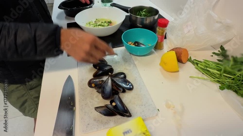 person preparing and cutting fresh vegetables