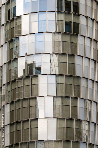 Abstract geometry on glass facade reflection of modern building structure combining design detail architecture and minimal contrast lighting