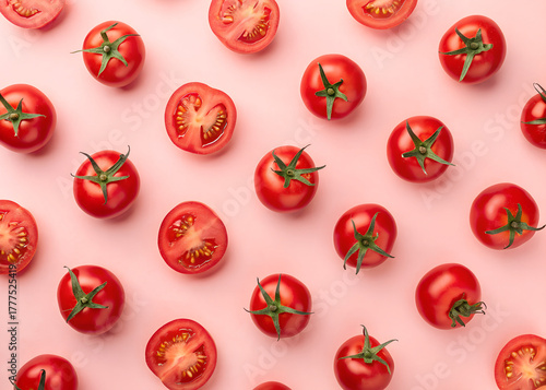 Red tomatoes arranged in repeating pattern on light pink background. This simple composition highlights fresh produce. Graphic design template element. This can be used for food related content.