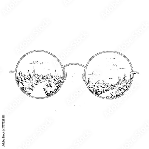 Round glasses reflecting a detailed landscape with buildings trees and a winding path in black and white style