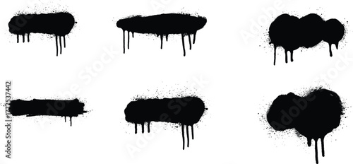 Set of various black spray paint splatters with dripping ink effect on white background