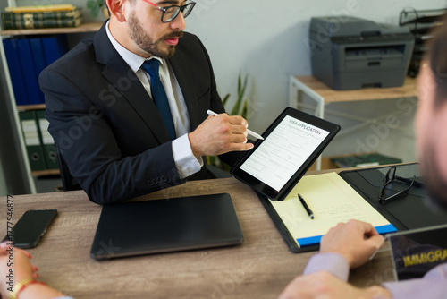 Immigration lawyer assisting client with visa application form
