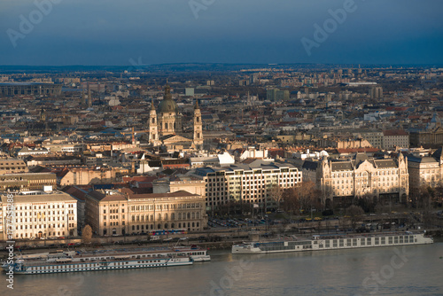 Photography The sun is setting over budapest casting long shadows on the danube river