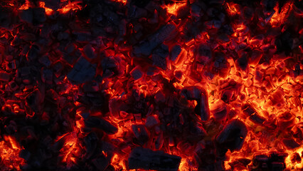 Fototapete Brennholz Textur background of burning and glowing hot coals. smoldering embers of fire. flicker of burning coals at night  © eliosdnepr