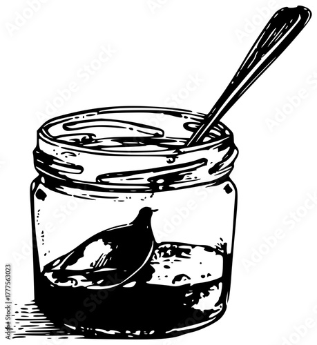 A jar with a jam spoon containing some food