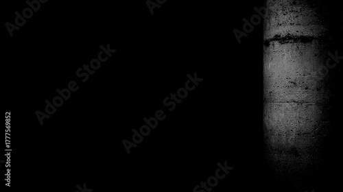negative. Minimalist architectural column detail in concrete with dramatic side lighting and monochrome tones. real-estate listings.