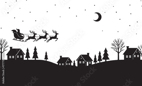 Santa Claus riding his sleigh across the moonlit sky