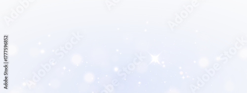 Shimmering dust glow sparkle particles softly expanding under dreamy luminous background.
